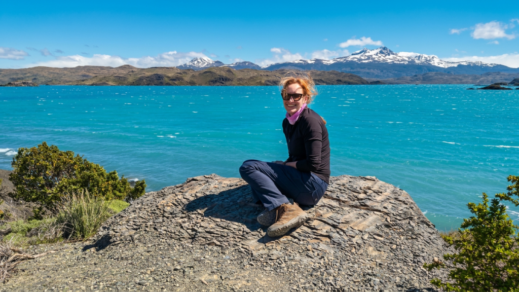 Bea by a mountain lake — please review our terms of use before exploring Bea Destinations